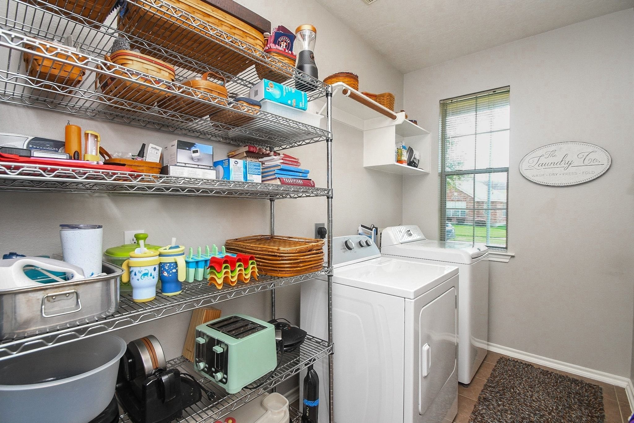 2402 Ligustrum Flower Drive Spring, TX 77388 - Photo 26 of 29 Extra space in the laundry room for storage or an extra refrigerator.
