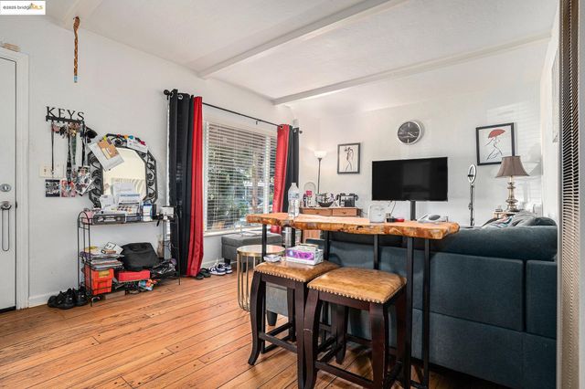 a view of a livingroom with furniture and a flat screen tv