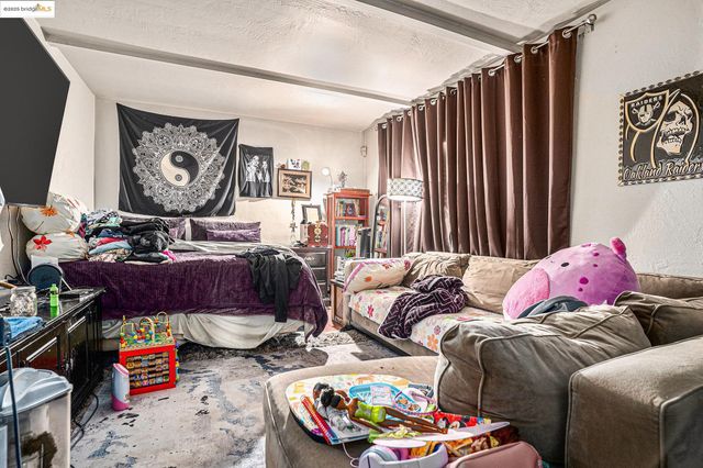 a bedroom with furniture and a window