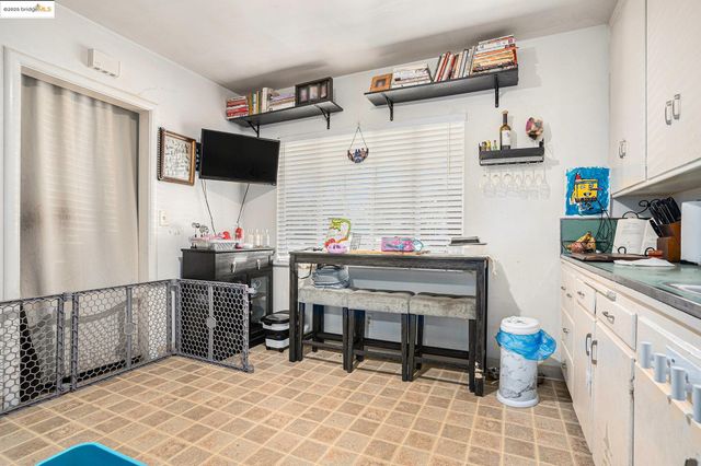 a kitchen with stainless steel appliances cabinets and a counter top space