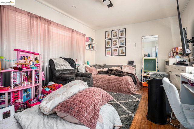 a kitchen with stainless steel appliances cabinets and a table