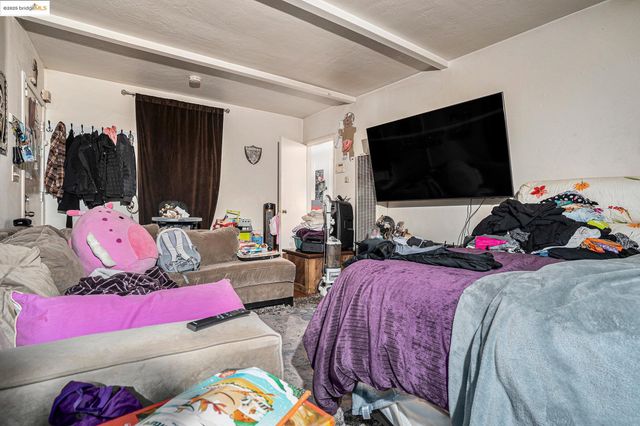 a bedroom with furniture and a bed