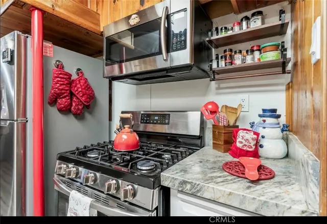 a kitchen with a stove and cabinets