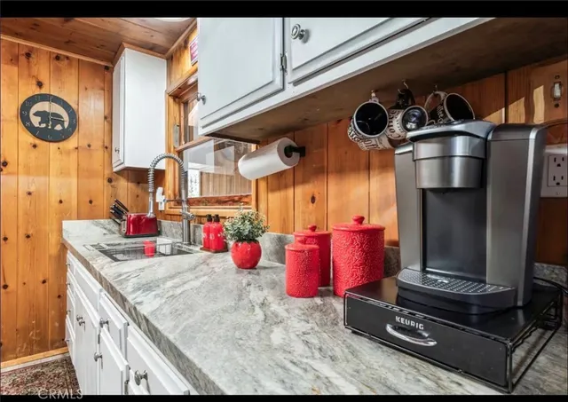 a kitchen with stainless steel appliances granite countertop a sink and cabinets