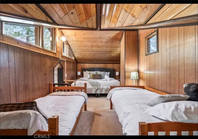 a bedroom with bed and window