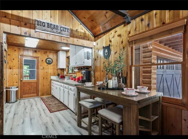 a kitchen view of a table and chairs in patio