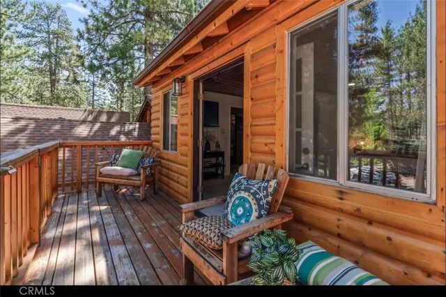 a view of balcony with two chairs and a table