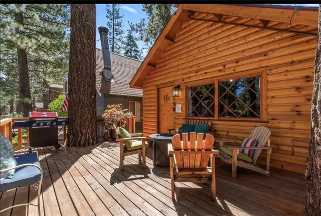 a view of a chairs and table on the deck