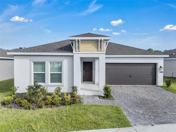 front view of a house with a yard