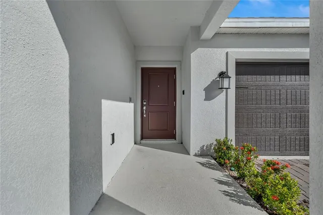 a view of a house with a potted plant