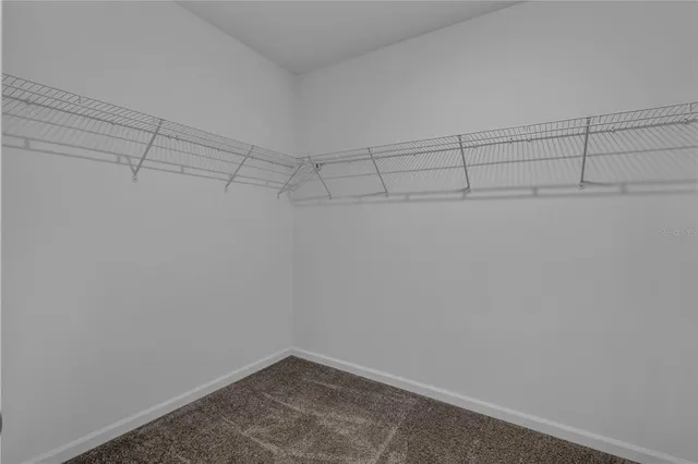 a view of a room with racks on the wall