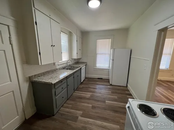 a kitchen with a stove and a refrigerator