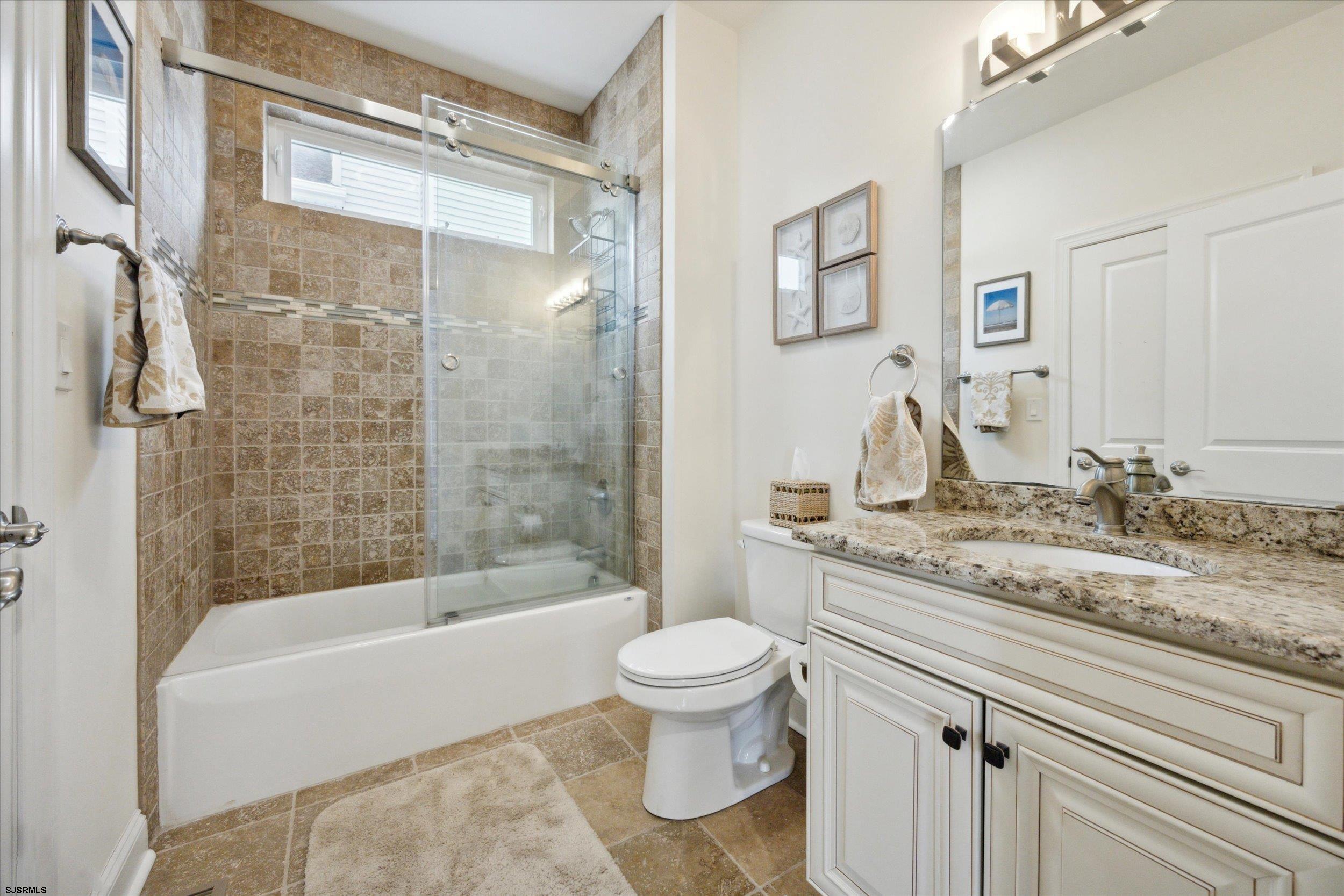 235 35th Street South Brigantine, NJ 08203 - Photo 16 of 56 a bathroom with a granite countertop sink toilet and shower