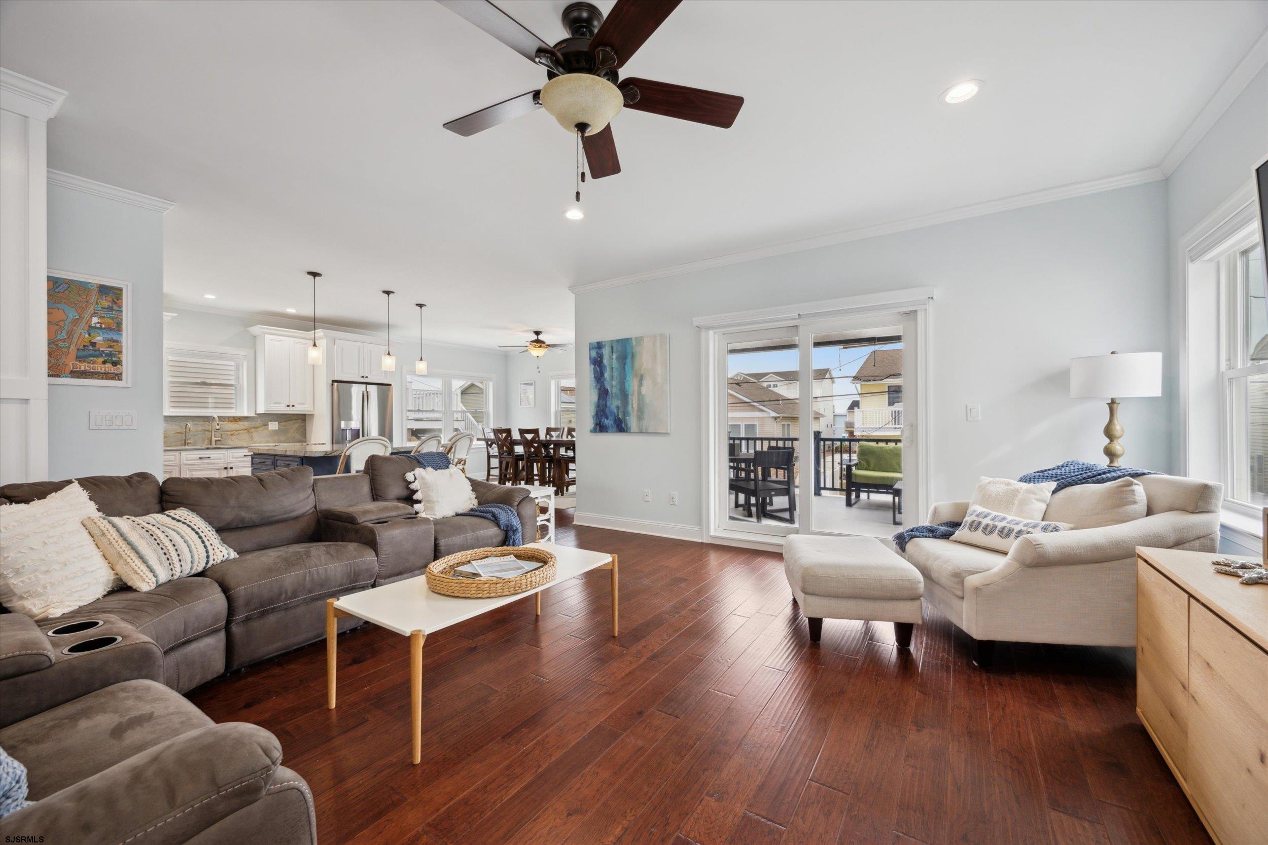 235 35th Street South Brigantine, NJ 08203 - Photo 17 of 56 a living room with furniture wooden floor and a large window