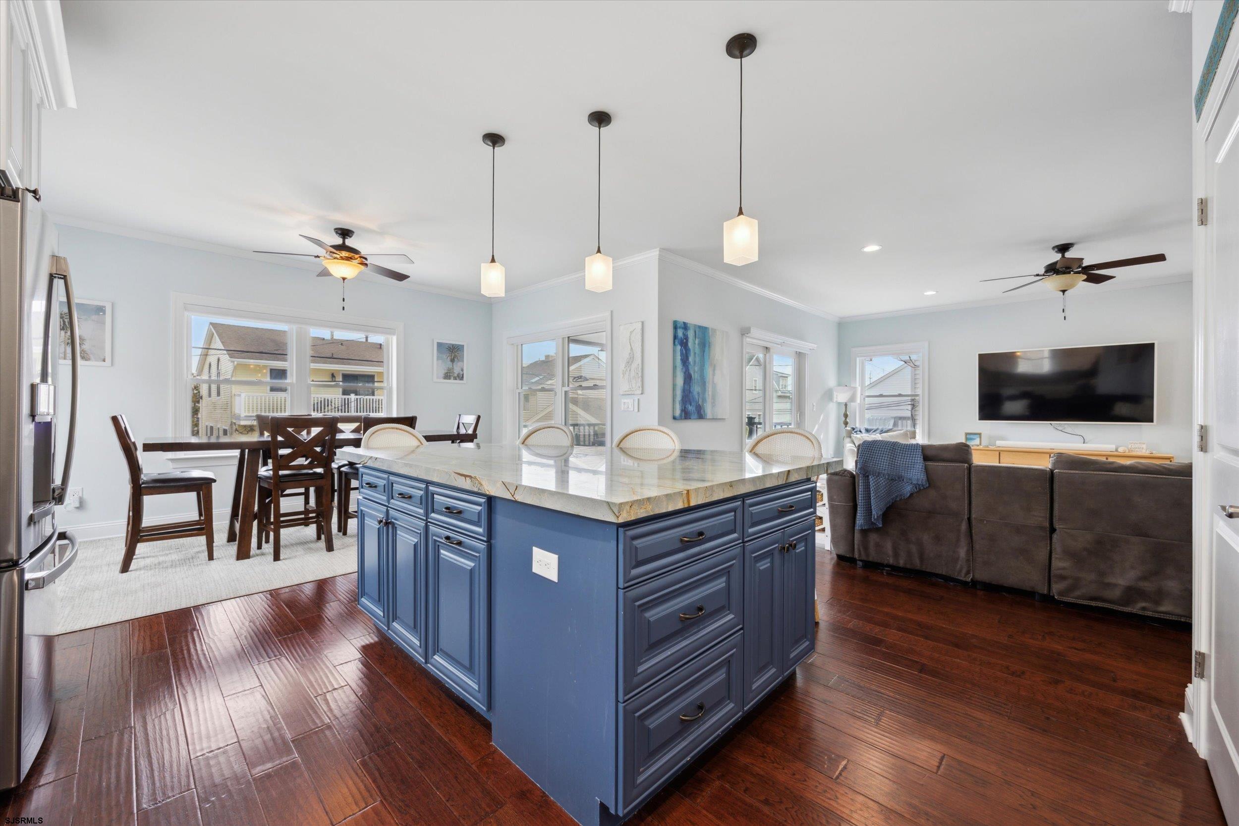 235 35th Street South Brigantine, NJ 08203 - Photo 20 of 56 a kitchen with stainless steel appliances granite countertop a stove and a wooden floors