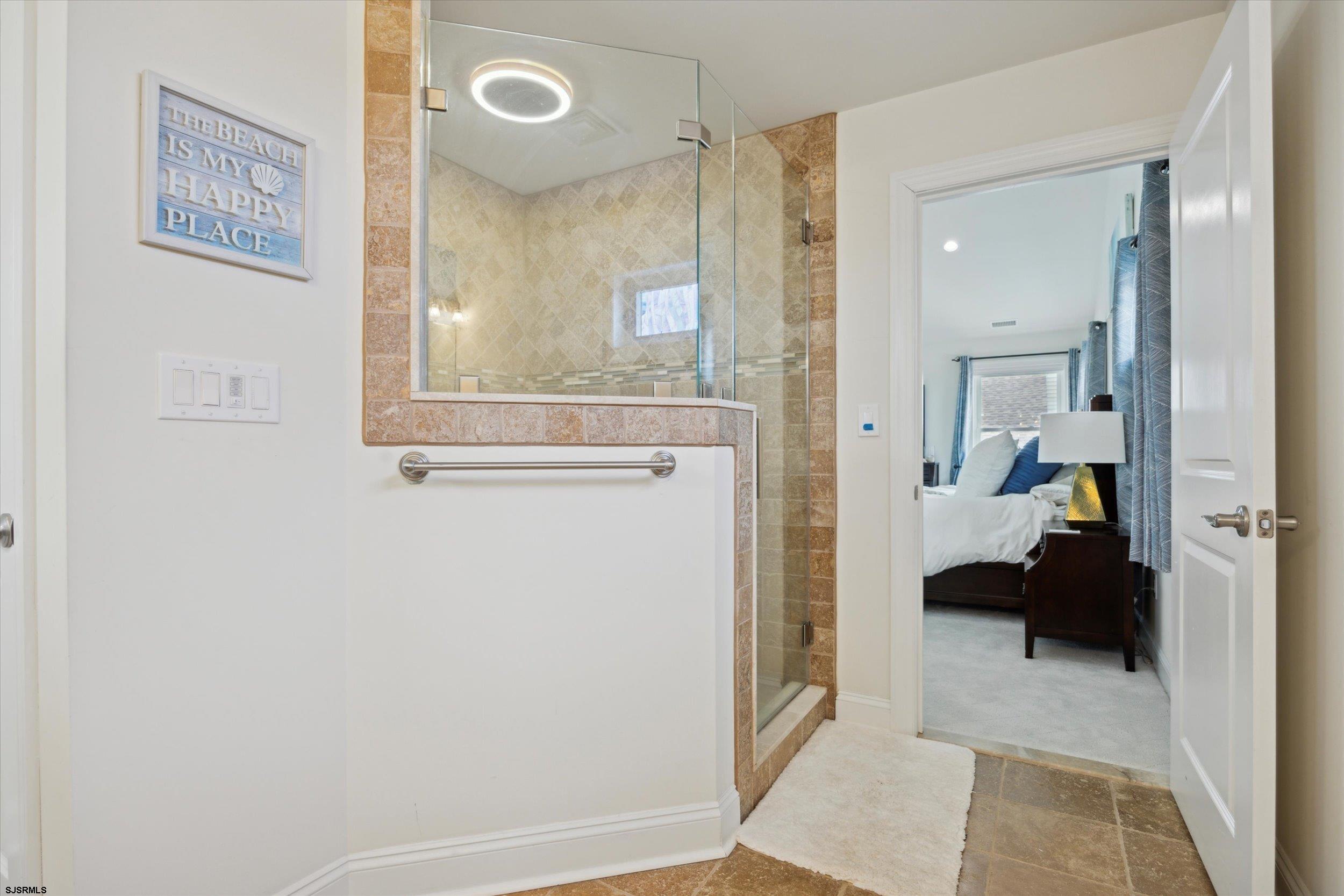 235 35th Street South Brigantine, NJ 08203 - Photo 25 of 56 a view of a bathroom with a sink and a mirror