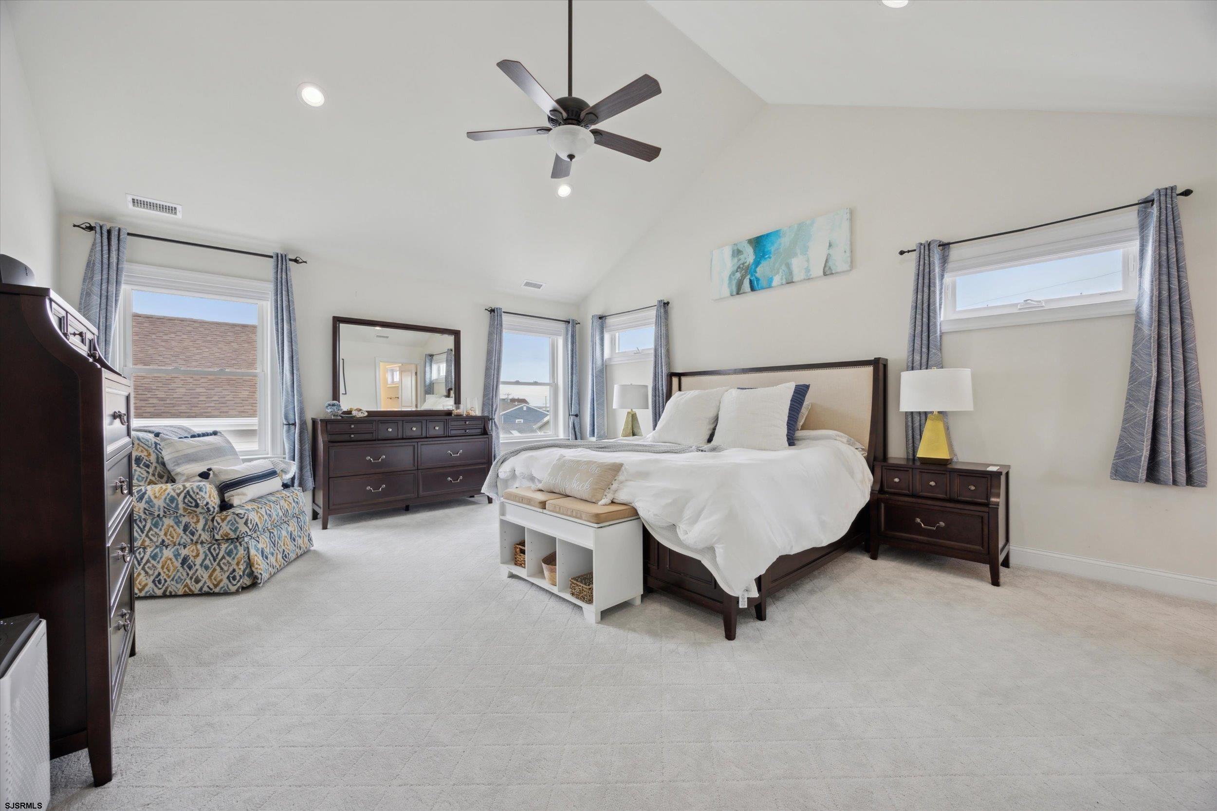 235 35th Street South Brigantine, NJ 08203 - Photo 26 of 56 a bed room with furniture and a flat screen tv
