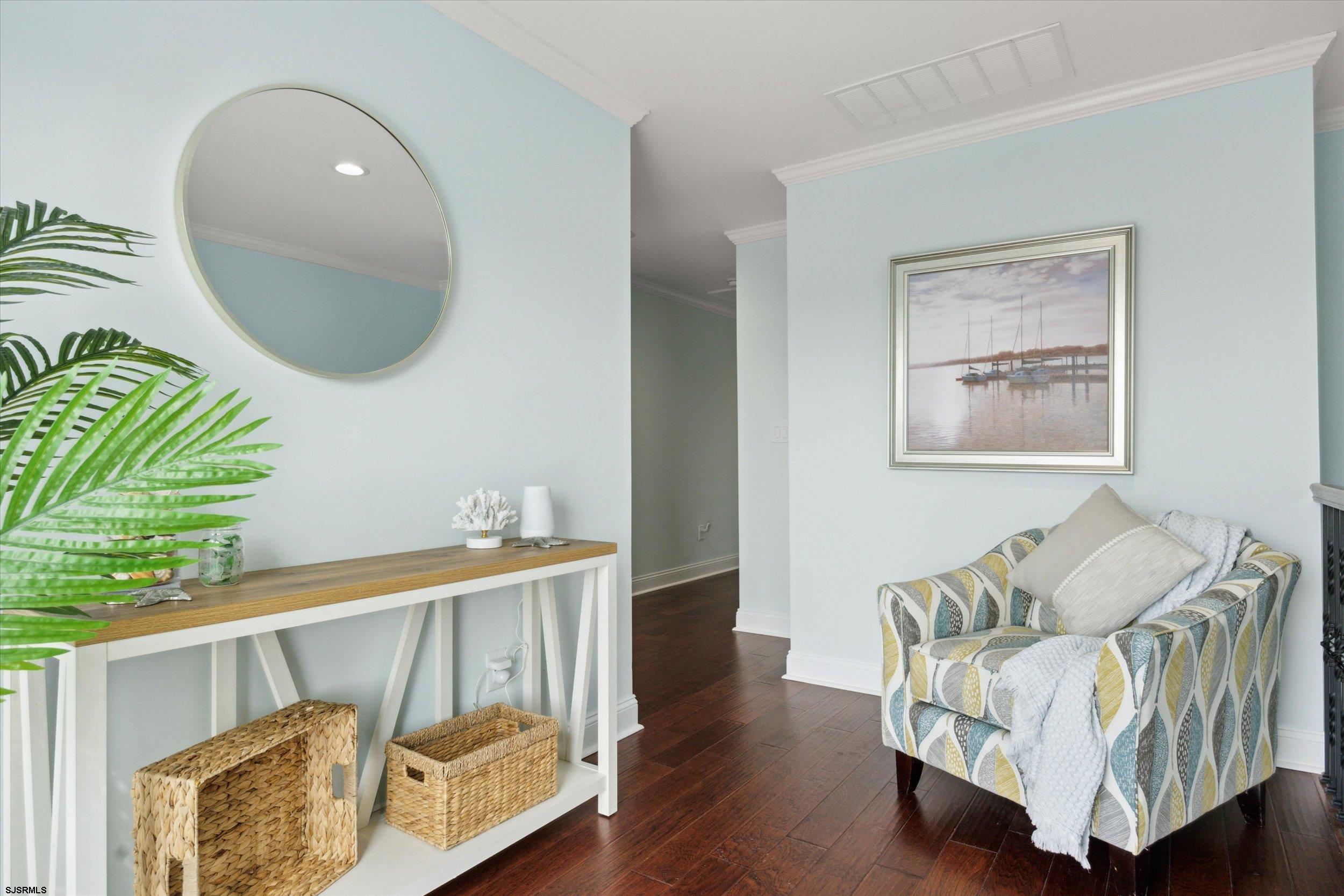 235 35th Street South Brigantine, NJ 08203 - Photo 26 of 56 a living room with furniture and a wooden floor