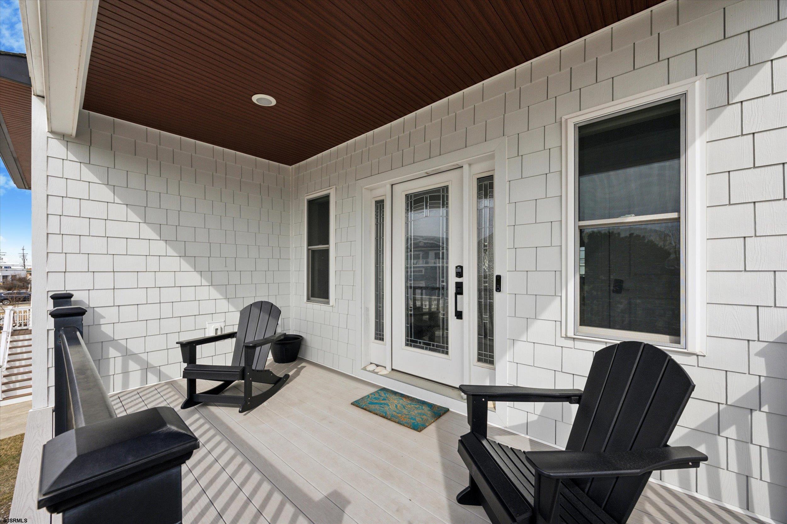 235 35th Street South Brigantine, NJ 08203 - Photo 3 of 56 a balcony with table and chairs