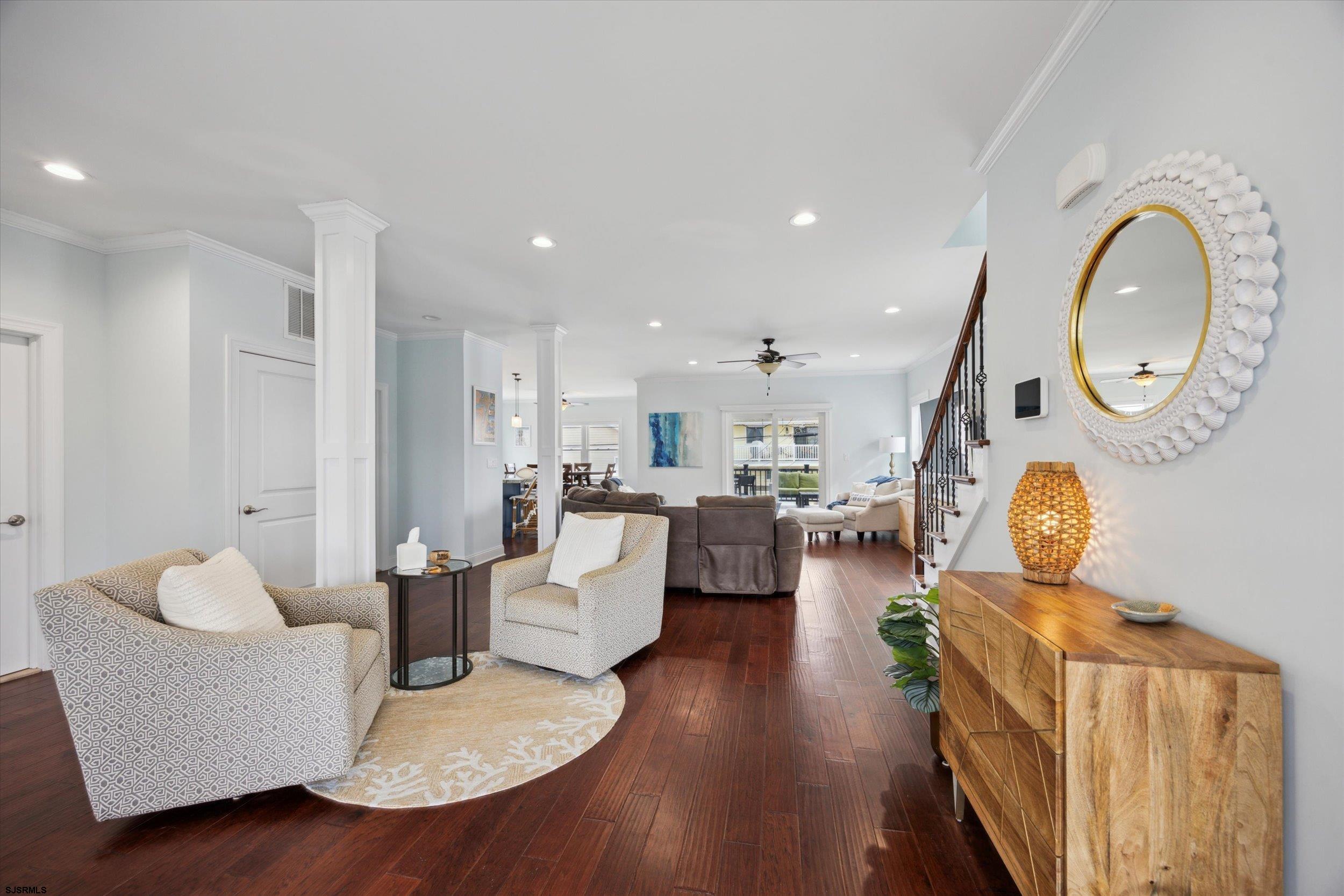 235 35th Street South Brigantine, NJ 08203 - Photo 4 of 56 a living room with fireplace furniture and a wooden floor