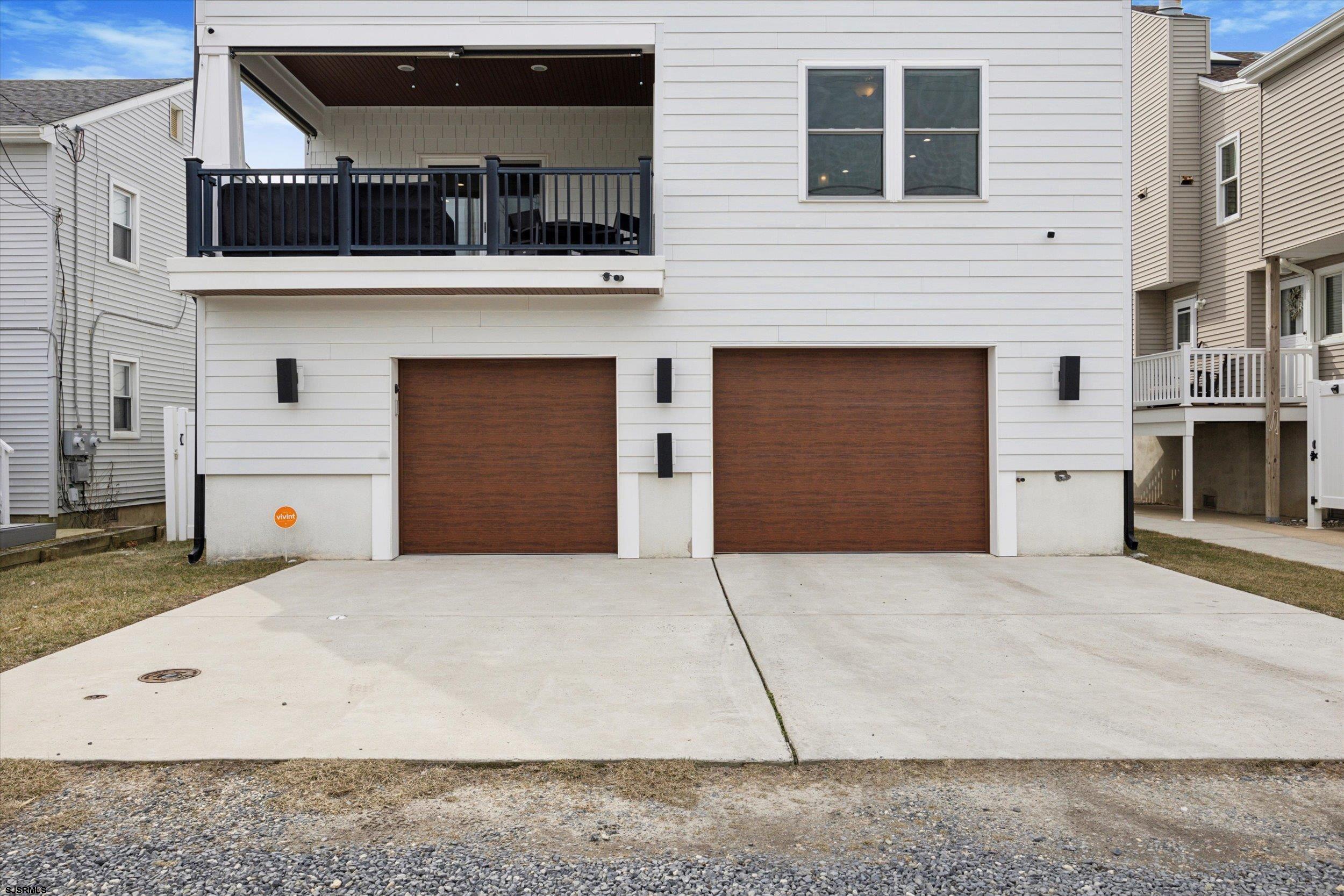 235 35th Street South Brigantine, NJ 08203 - Photo 46 of 56 a front view of a house with a garage