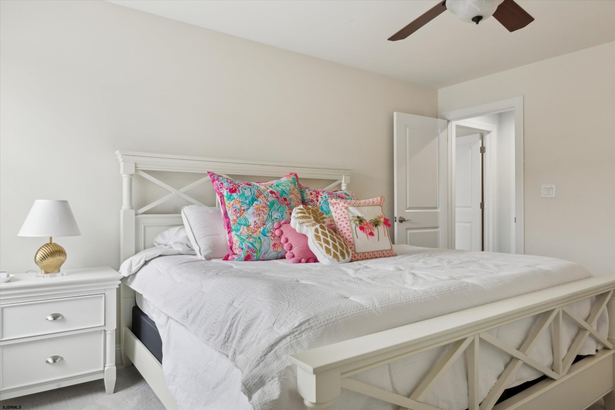 235 35th Street South Brigantine, NJ 08203 - Photo 49 of 56 a bedroom with a bed and a dresser