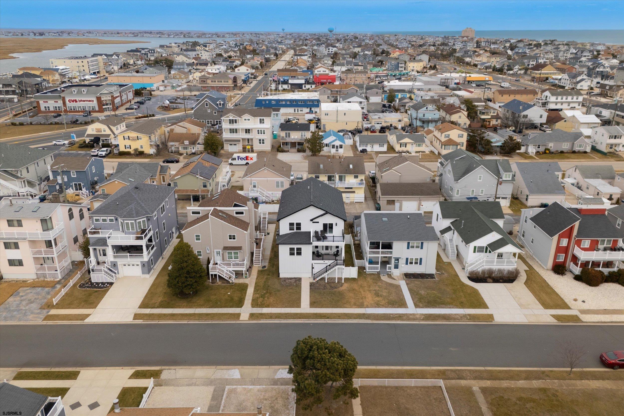 235 35th Street South Brigantine, NJ 08203 - Photo 53 of 56 an aerial view of a residential apartment building with parking