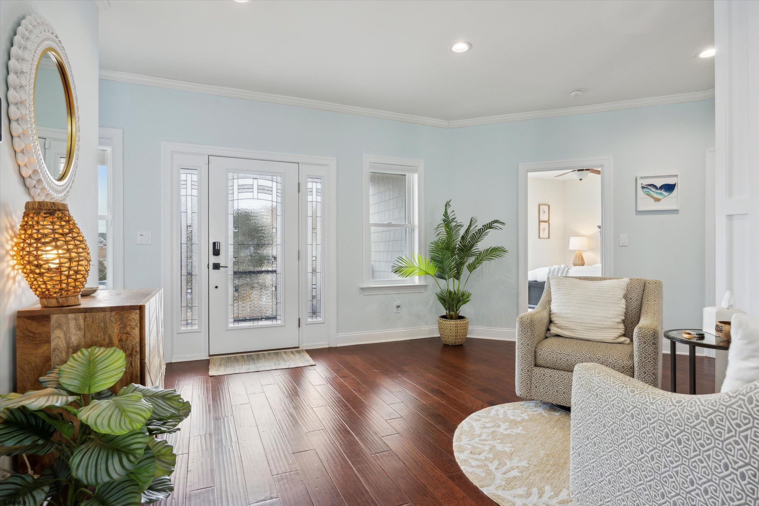 235 35th Street South Brigantine, NJ 08203 - Photo 6 of 56 a living room with furniture potted plant and wooden floor
