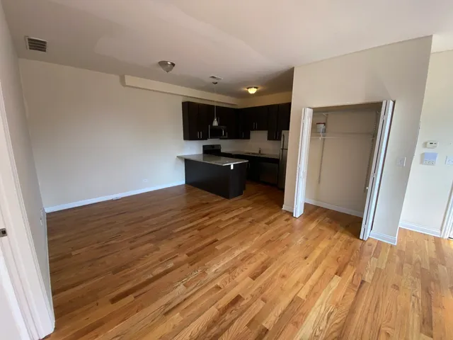 a view of a kitchen from the hallway