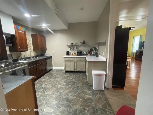 a kitchen with a sink and appliances