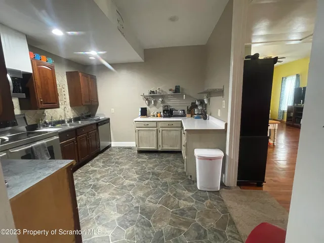 a kitchen with a sink and appliances