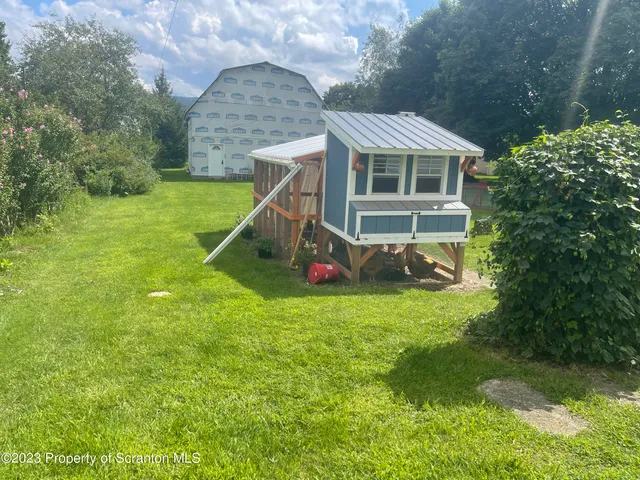 a view of a patio with a yard
