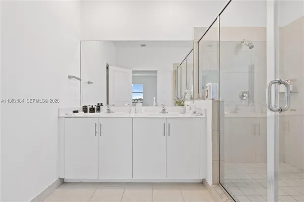 a bathroom with a sink and mirror