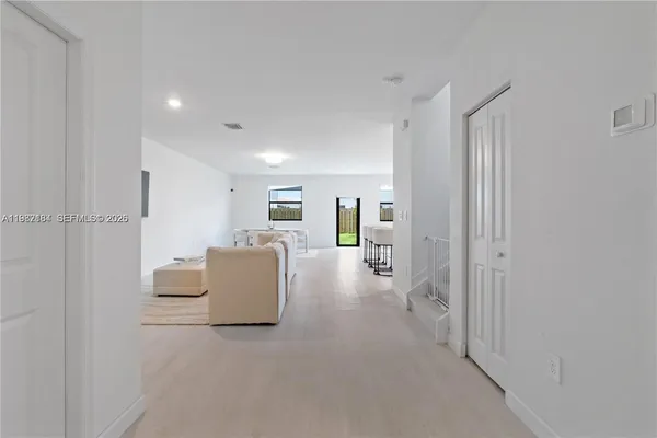 a view of a livingroom with furniture and windows