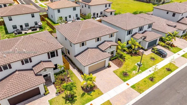 an aerial view of a house with a swimming pool