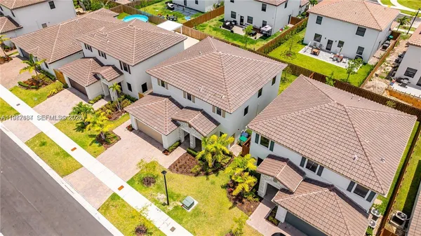 an aerial view of residential building and lake