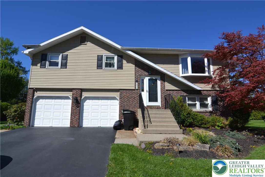 3071 Athena Drive Bethlehem, PA 18017 - Photo 2 of 27 a front view of a house with a yard
