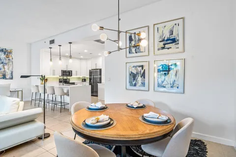 a kitchen with cabinets stainless steel appliances and a counter space