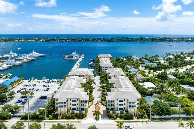 a kitchen with stainless steel appliances a refrigerator sink and microwave