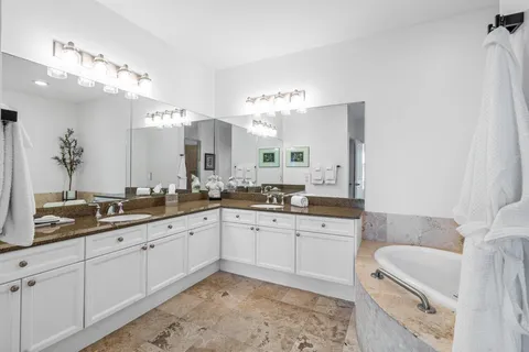 a bathroom with a sink toilet and mirror