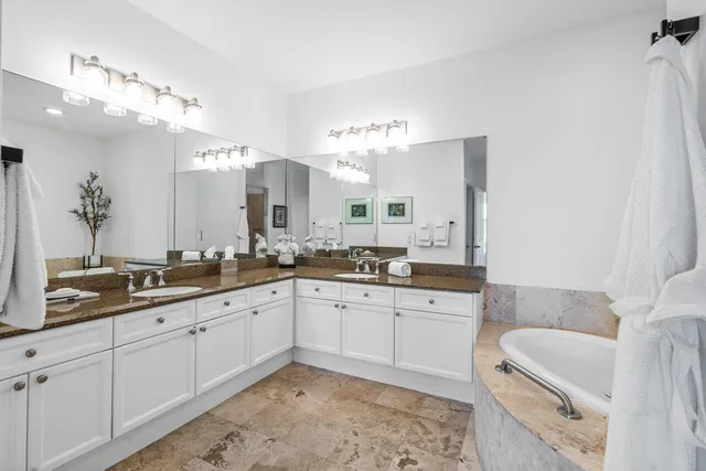 a bathroom with a sink toilet and mirror