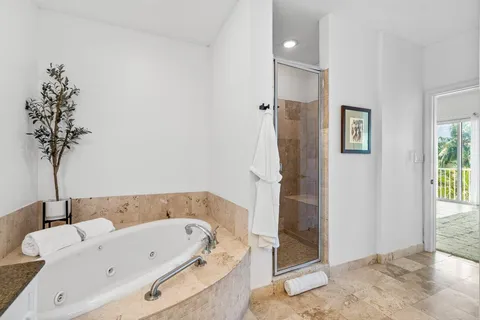 a view of storage and utility room with washer and dryer