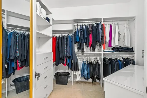 a front view of a multi story residential apartment building with a yard