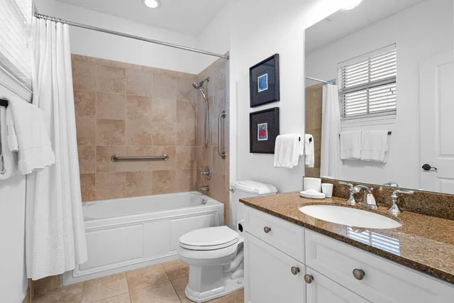 a view of a swimming pool with a lounge chair and palm trees