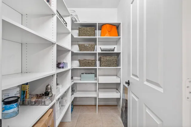 a balcony with wooden floor and city view