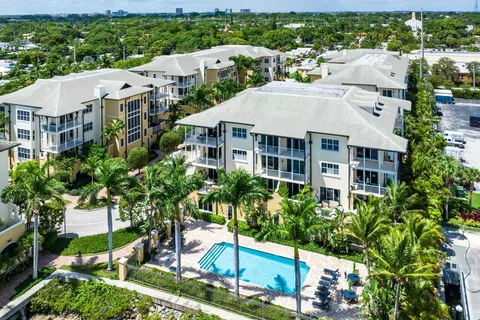 a group of people sitting in front of a cafe