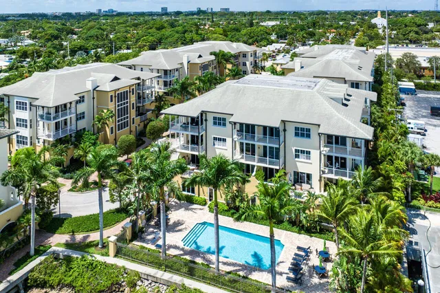a group of people sitting in front of a cafe