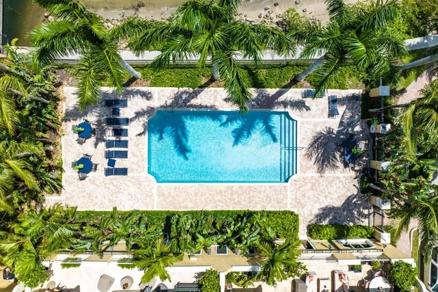 a view of a house with a small yard and plants