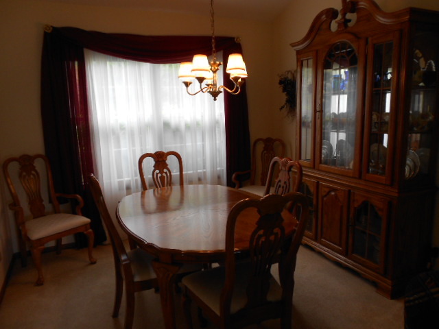 454 Prairieview Drive Oswego, IL 60543 - Photo 8 of 14 a view of a dining room with furniture and chandelier