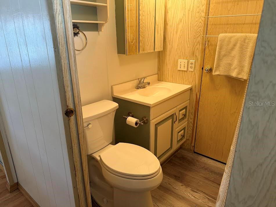 5168 Rubber Tree Circle New Port Richey, FL 34653 - Photo 11 of 36 a bathroom with a sink and a mirror